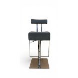 A contemporary bar stool having a grey velour upholstered back and seat with chrome stem and