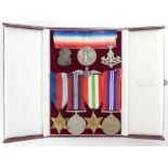 Various WWII medals, a silver RAF wings brooch, an ARP badge, a Edward VII Boer War medal and a