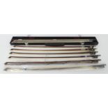 Seven vintage violin bows, one marked F&H London, two enclosed in a hard case, case 57cm x 5cm.