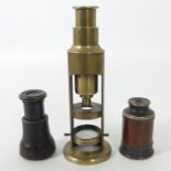 A 19th century brass drum microscope, together with two pocket spy glasses, 16cm.