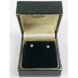 A pair of 18ct gold and diamond stud earrings, .9 grams, 3.5mm.