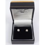 A pair of 18ct yellow and white gold diamond stud earrings (4mm dia stones), 1 gram.