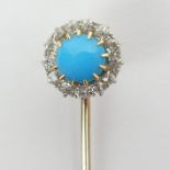 A gold, turquoise and diamond cluster stick pin, circa 1900, 2.2 grams, top 10mm x 59mm long.