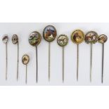 Ten Victorian and later horse design stick pins, 31.4 grams, largest 21.4mm.