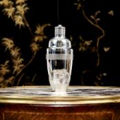 A SILVER COCKTAIL SHAKER