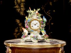 MEISSEN: A PORCELAIN FLOWER ENCRUSTED ORNITHOLOGICAL MANTEL CLOCK