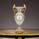 A FINE 19TH CENTURY EMPIRE STYLE CUT GLASS AND ORMOLU VASE CLOCK IN THE STYLE OF BACCARAT