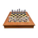 LLADRO: A PORCELAIN CHESS SET WITH STAINED WOOD BOARD