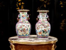 A PAIR OF 19TH CENTURY CHINESE EXPORT CANTON PORCELAIN VASES