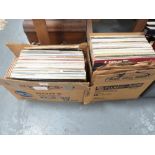 Two trays of assorted LP records and 7" singles