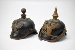 (2) German Artillery & Infantry Helmets.