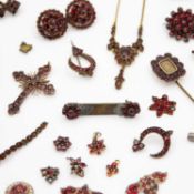 A selection of small silver and base metal garnet jewellery items.