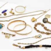 A selection of 9k gold bronze core bangles and other gold-plated jewellery.