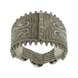 An Indian silver hinged bangle.