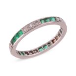 A late Art Deco eternity ring, comprising alternating segments of square-cut emeralds in channel