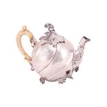 An Eighteenth century bachelor’s teapot, possibly German or Dutch, of spirally lobed melon form,