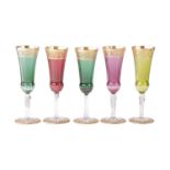 Five Saint Louis 'Thistle' Champagne flutes, in coloured crystal glass with gilt overlay, etched