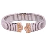 Bulgari - A diamond-set tubogas open bangle, comprising a flexible stainless steel tubogas band with