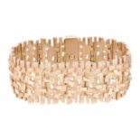 An 18ct gold bracelet of brutalist design by David Shackman and Sons, comprising hinged links of