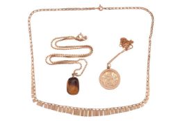 A tiger’s eye pendant, to a 9ct yellow gold box link chain, together with a 9ct gold St Christopher 