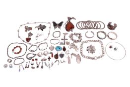 A group of white metal costume jewellery to include; eight white metal bangles with granulation and 