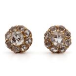 A pair of diamond rosette shaped ear studs.