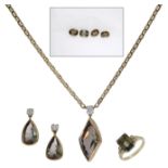 A suite of andalusite jewellery, the ring by Garrard &amp; Co., and set with a step-cut...