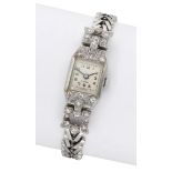 Swiss. A lady's platinum and diamond-set cocktail watch, circa 1930. Movement: manual...