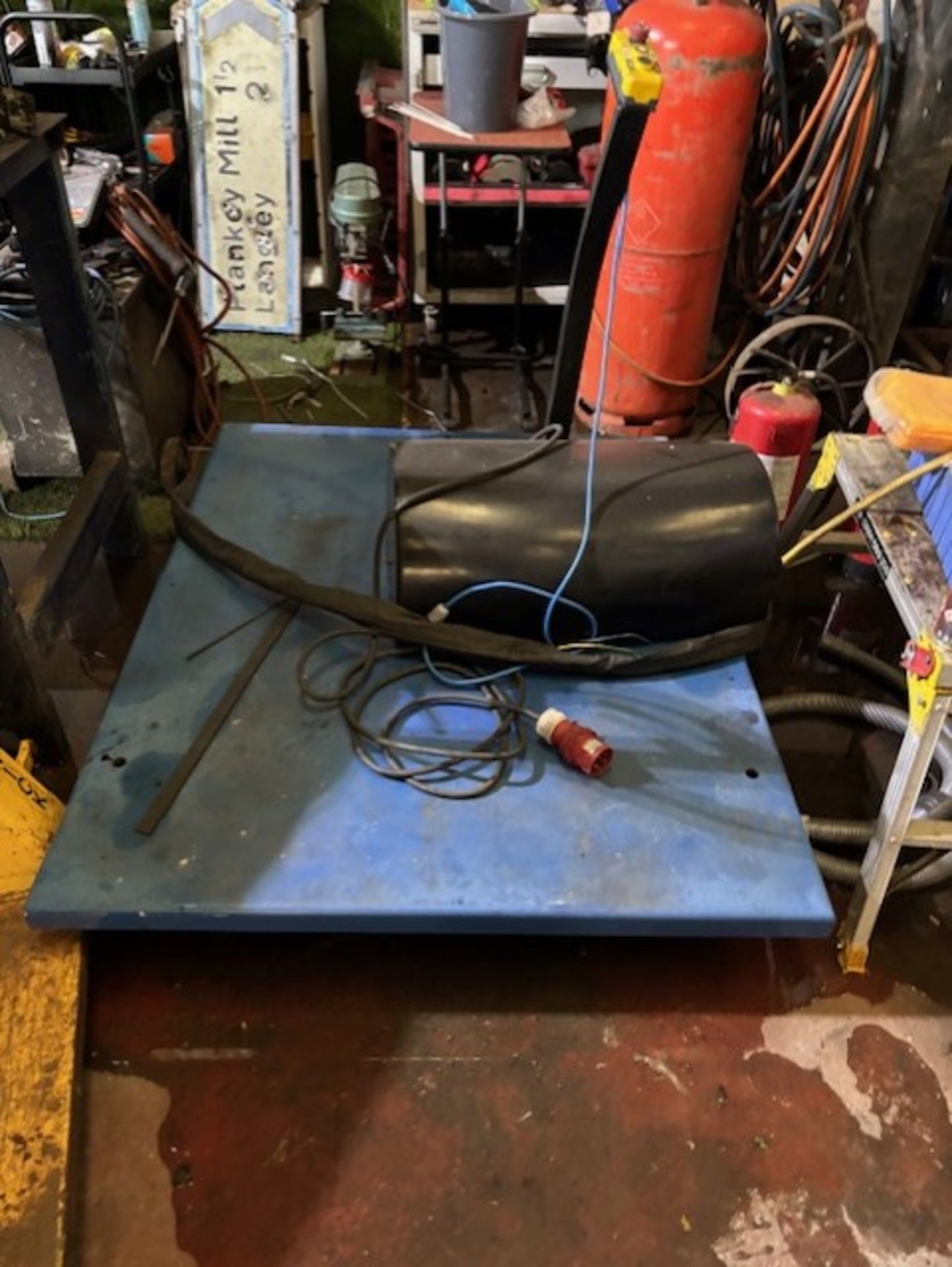 3 phase table lift that can sit in the ground it is new unused and works perfect it is 1.5 x 1.15 in