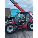 Manitou 634 it’s just the 7 metre reach has a big bucket with it also it has a loose belt that is
