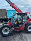 Manitou 634 it’s just the 7 metre reach has a big bucket with it also it has a loose belt that is