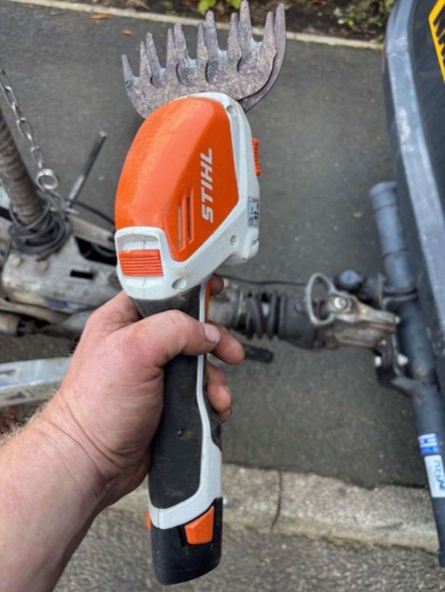 Stihl little pruner for shearing shrubbery good little tool no charger but battery with it