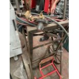 Oxy acetylene bottle cart with the hoses and bright taps pressure adjusters