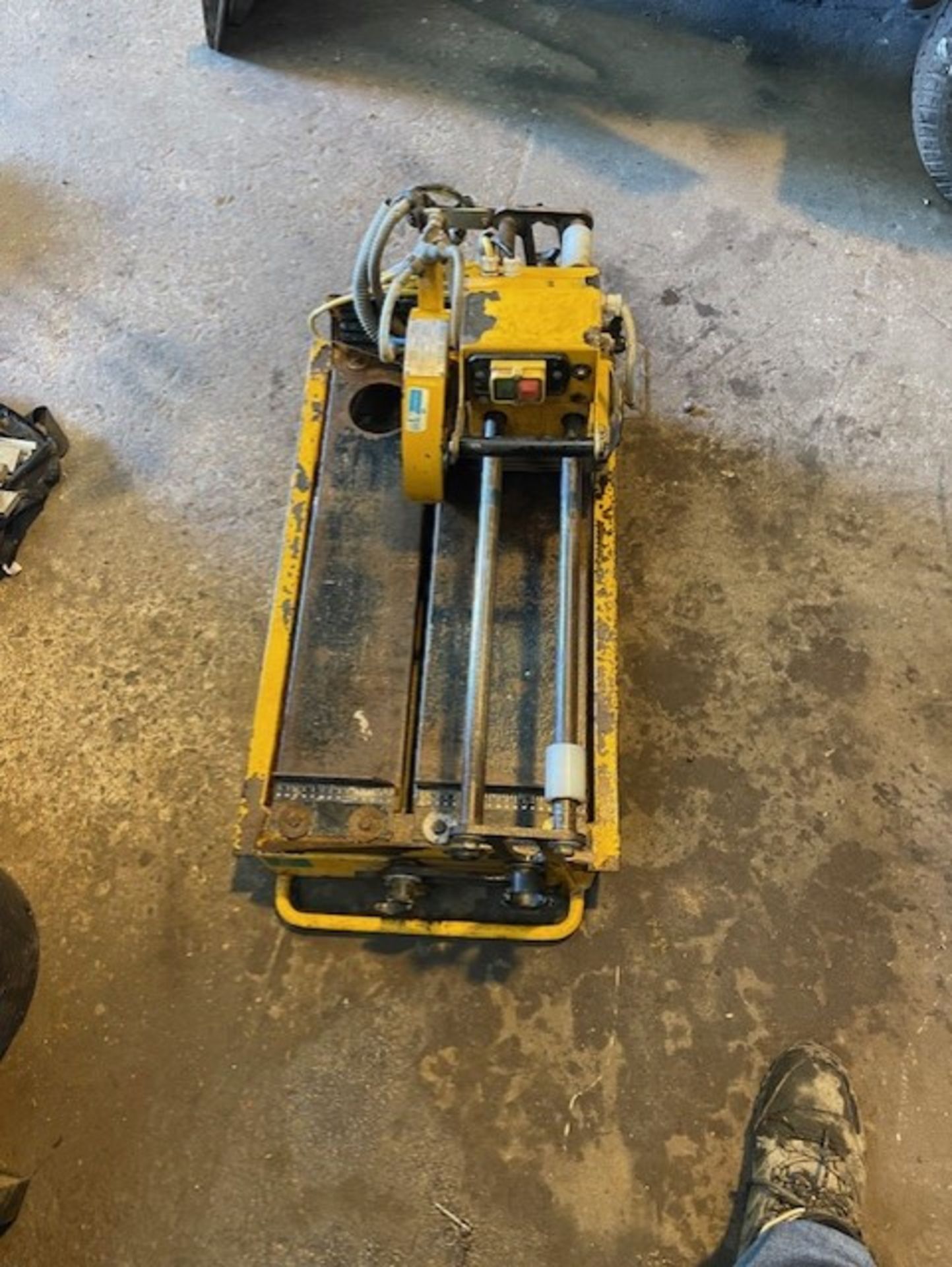 Wet style tile utter on a 110 volt machine is 800mm long  and 500mm wide weighs 40 kilos