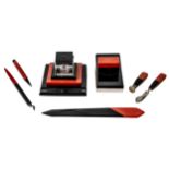 A GROUP OF ART DECO BAKELITE DESK ACCESSORIES in black and coral tones, the lot consisting of an