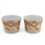 A PAIR OF CACHE POTS decorated with friezes of seashells and seaweed over a polychrome