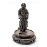 A SMALL JAPANESE BRONZE OKIMONO MEIJI PERIOD (1868-1912) modelled as a standing Bijin, raised on a