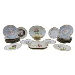 A GROUP OF FIFTEEN MEISSEN DINNER PLATES decorated with floral painted scrolling cartouches,