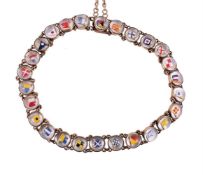 AN EARLY 20TH CENTURY REVERSE PAINTED INTAGLIO BURGEE FLAG BRACELET