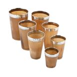 A SET OF SIX VICTORIAN SILVER MOUNTED GRADUATED HORN BEAKERS