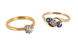 A DIAMOND SINGLE STONE RING AND A SAPPHIRE AND DIAMOND THREE STONE RING