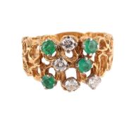 AN EMERALD AND DIAMOND DRESS RING