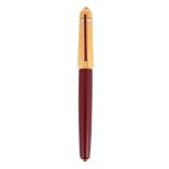 CARTIER, PASHA DE CARTIER, A GILT AND MAROON FOUNTAIN PEN