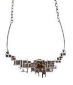 OLA M. GORIE, A SILVER AND HAWKS EYE NECKLACE