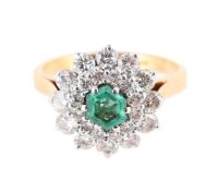 A DIAMOND AND EMERALD CLUSTER RING