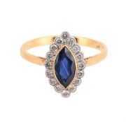 A SAPPHIRE AND DIAMOND CLUSTER RING
