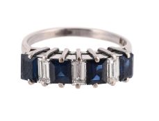 A SAPPHIRE AND DIAMOND BAND RING