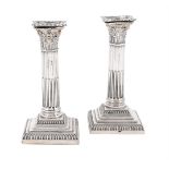 A PAIR OF VICTORIAN SILVER CORINTHIAN CANDLESTICKS