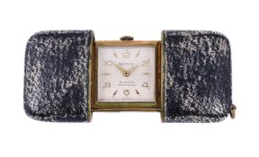 HERMÈS A GILT METAL AND LEATHER PURSE WATCH