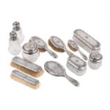 A FRENCH SILVER MOUNTED TWELVE PIECE DRESSING TABLE SET